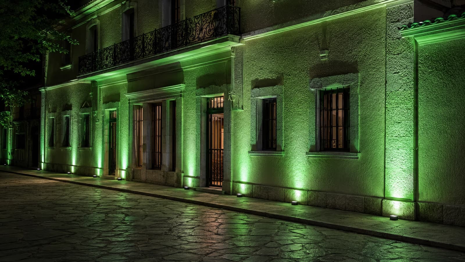 Building facade illuminated with architectural uplighting