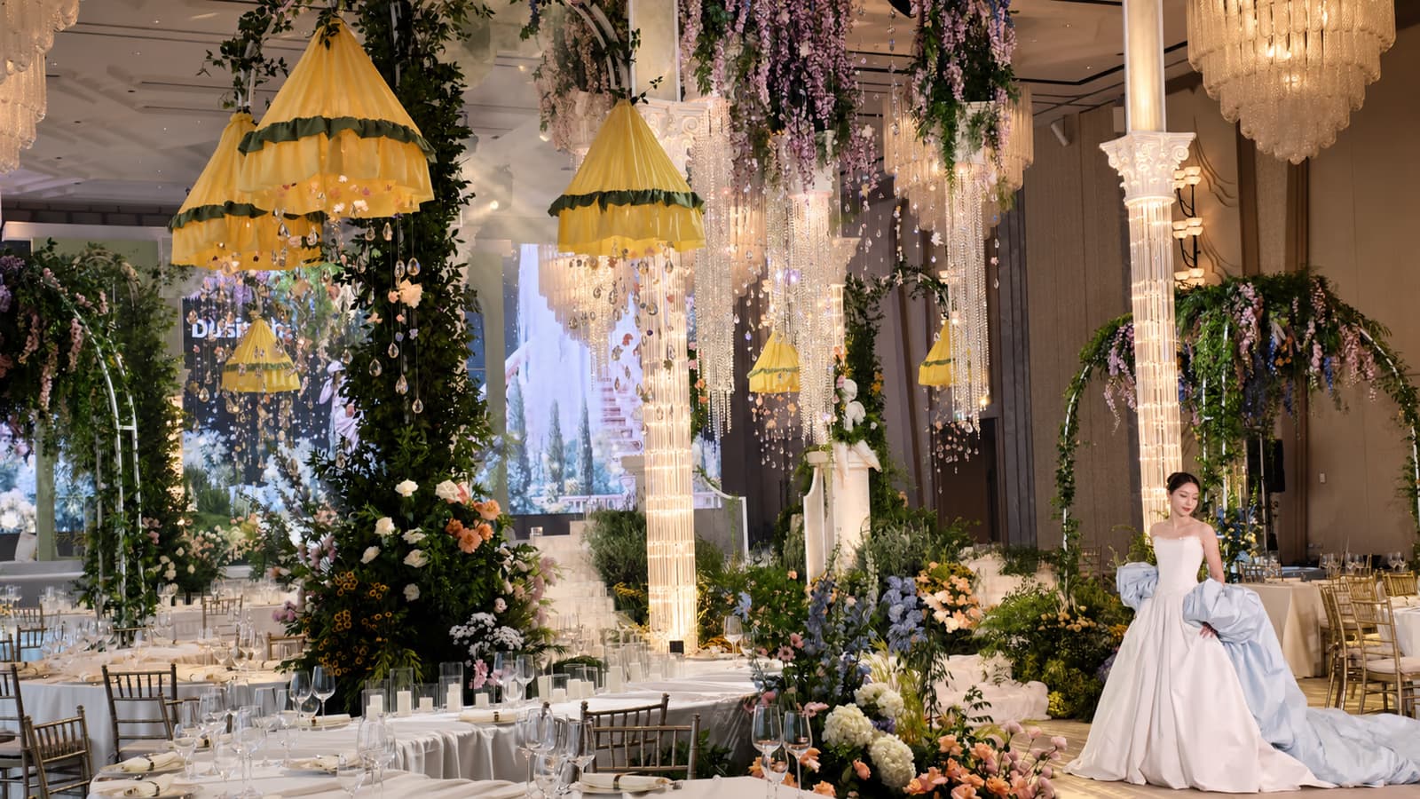 Wedding banquet venue with decorative uplighting