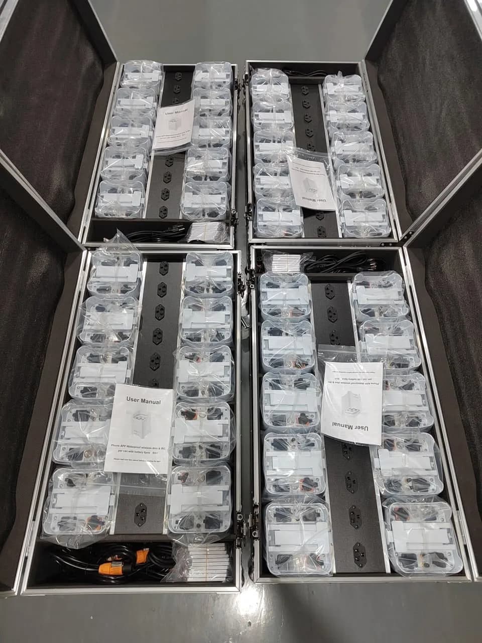 Compact battery uplights and chargers organized in four charging flight cases