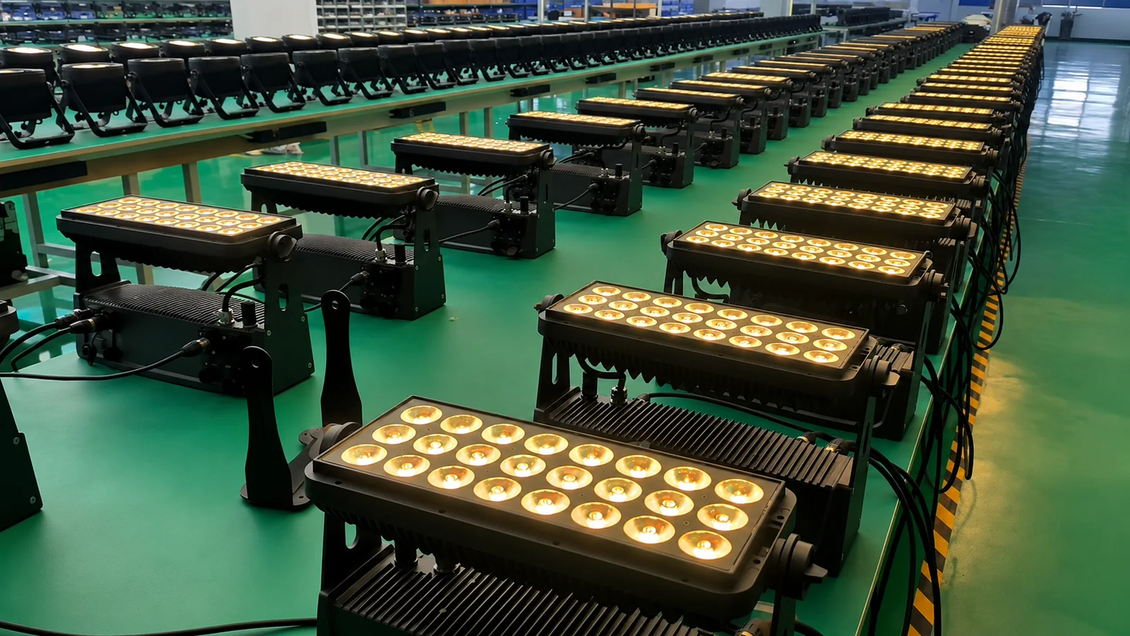Rows of LumiUp battery lights undergoing a warm-white output test on the factory floor
