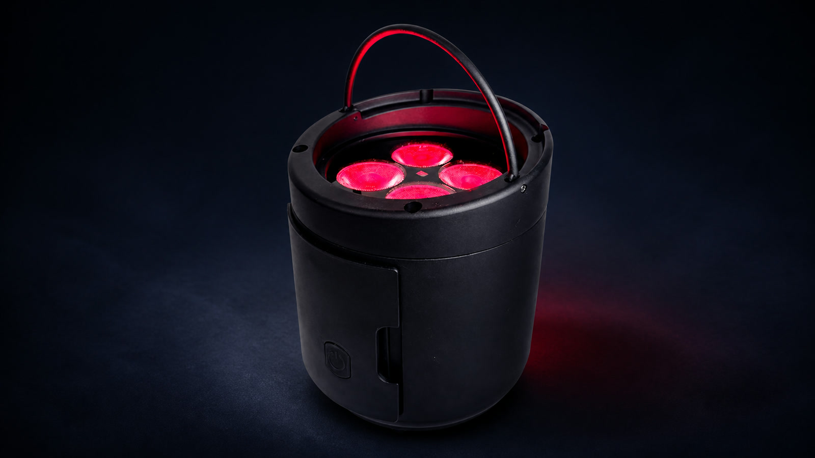 LumiUp Aqua P4RX removable battery uplight with four red lenses in a dark studio setting