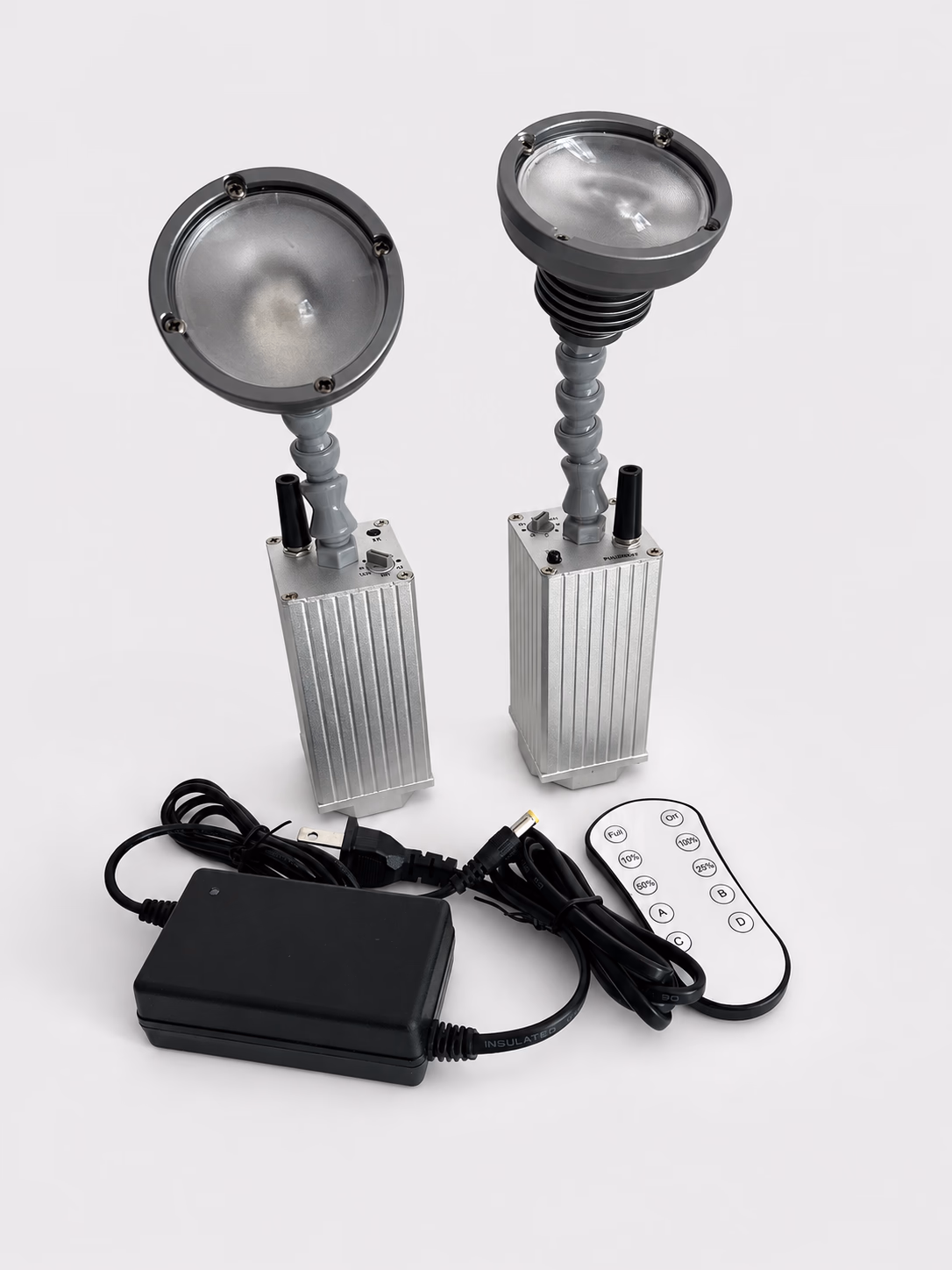 LumiUp Mini S1 pinspot set shown with charger and infrared remote control