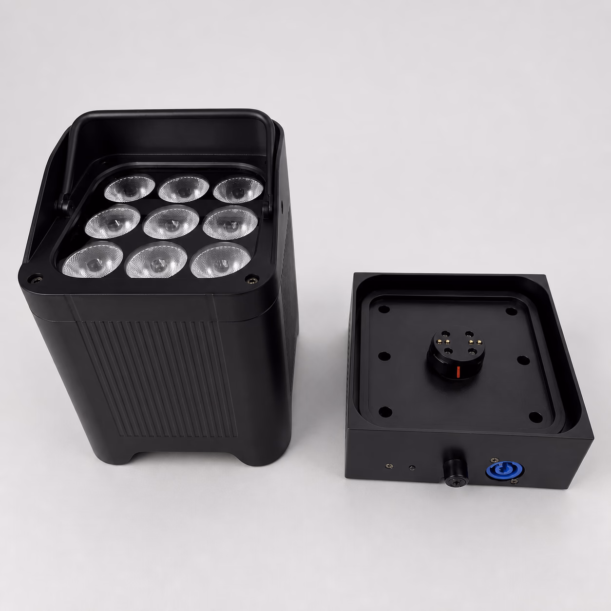 LumiUp Aqua P9X beside the dedicated drop-in charging base