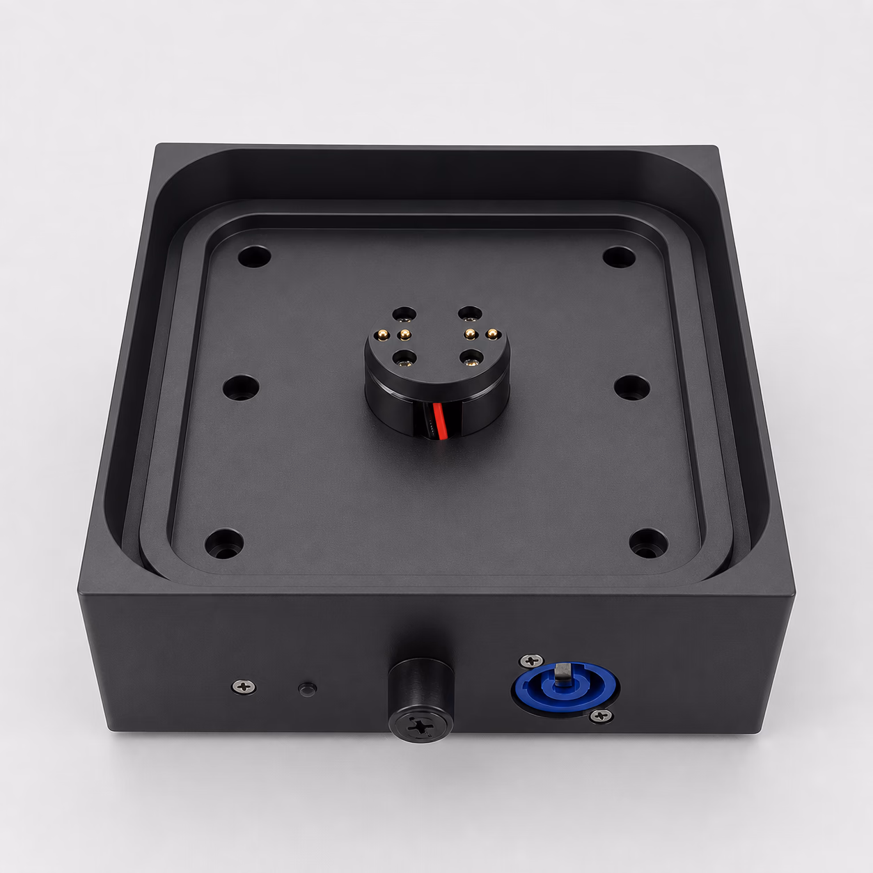 Studio view of the LumiUp Aqua P9X Charging Base with its central contacts, fuse holder and power input